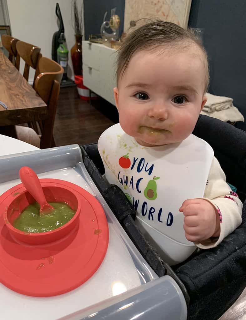Mila eating pear and spinach