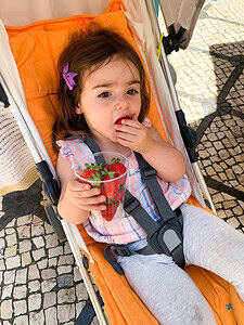 Strawberry snacking in Portugal with a Toddler